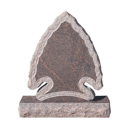 Emerson Monument Company Rustic Brown Granite Arrowhead Cemetery Memorial with a Shell Rock Border on the Front of the monument